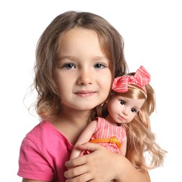 Photo of Cute little girl holding doll on white background