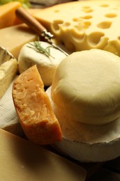 Photo of Different types of cheese on table, closeup