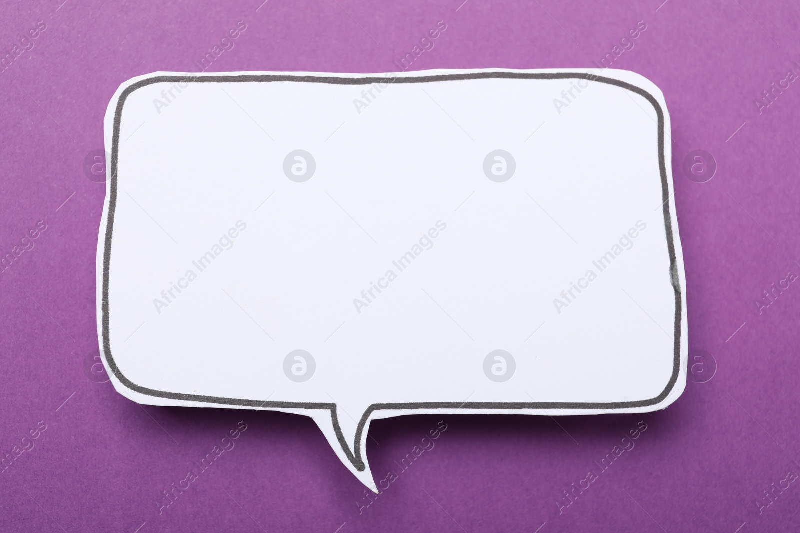 Photo of Blank speech bubble on purple background. Space for text