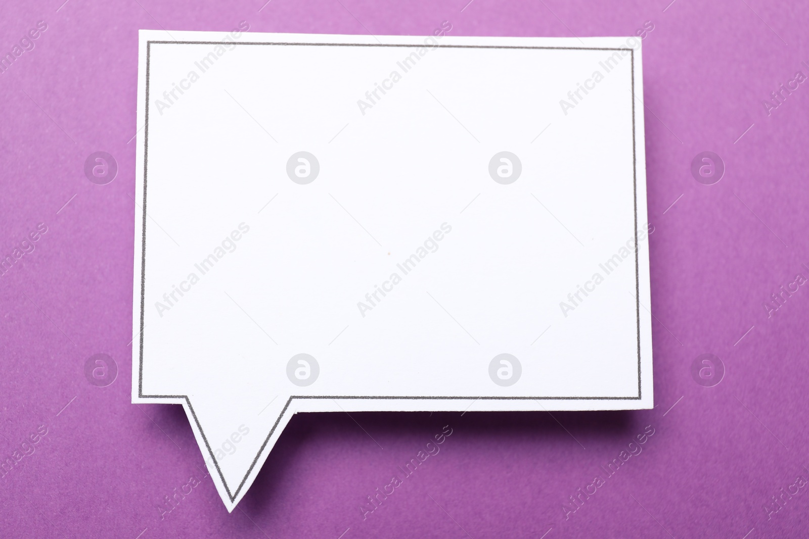 Photo of Blank speech bubble on purple background. Space for text