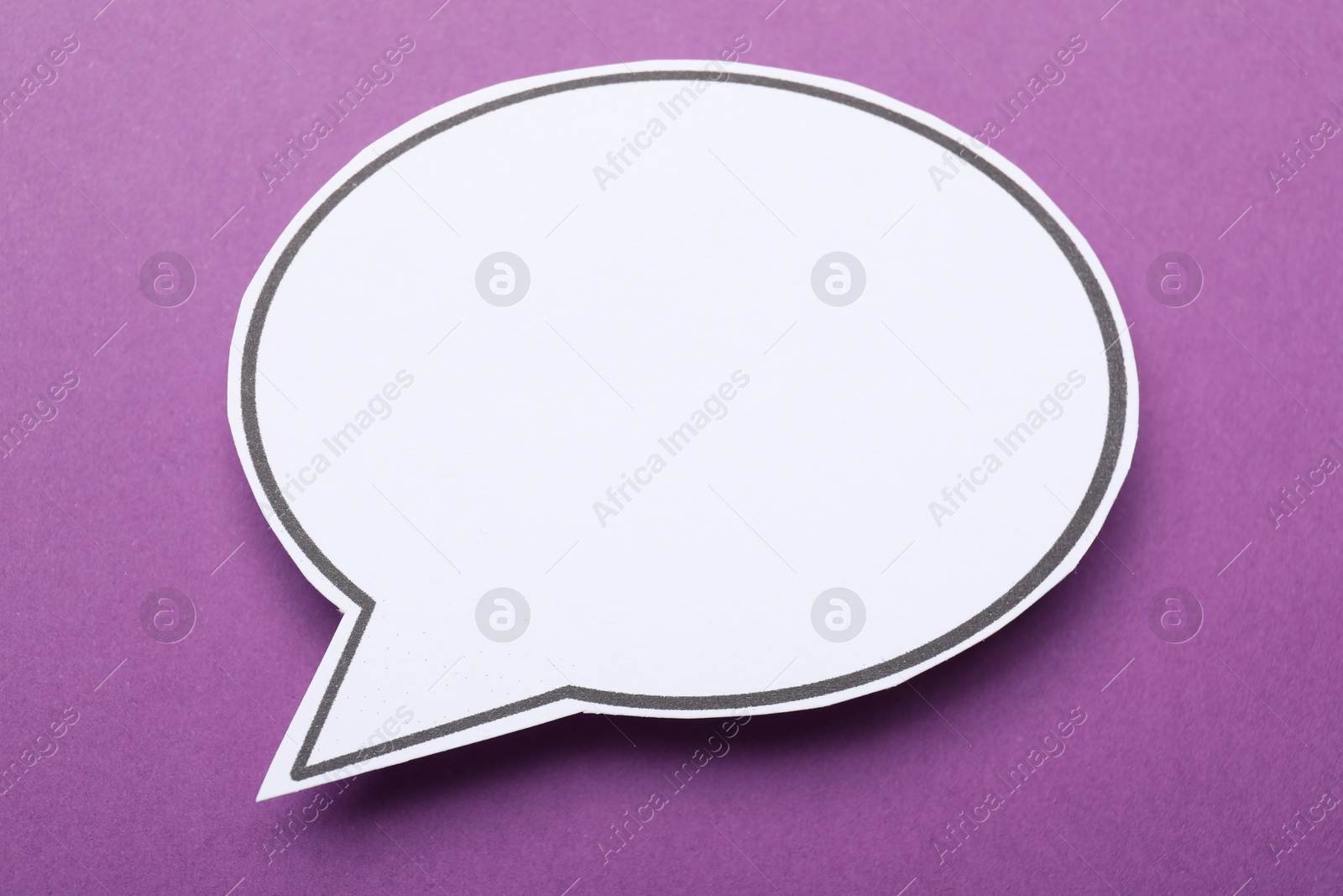 Photo of Blank speech bubble on purple background. Space for text