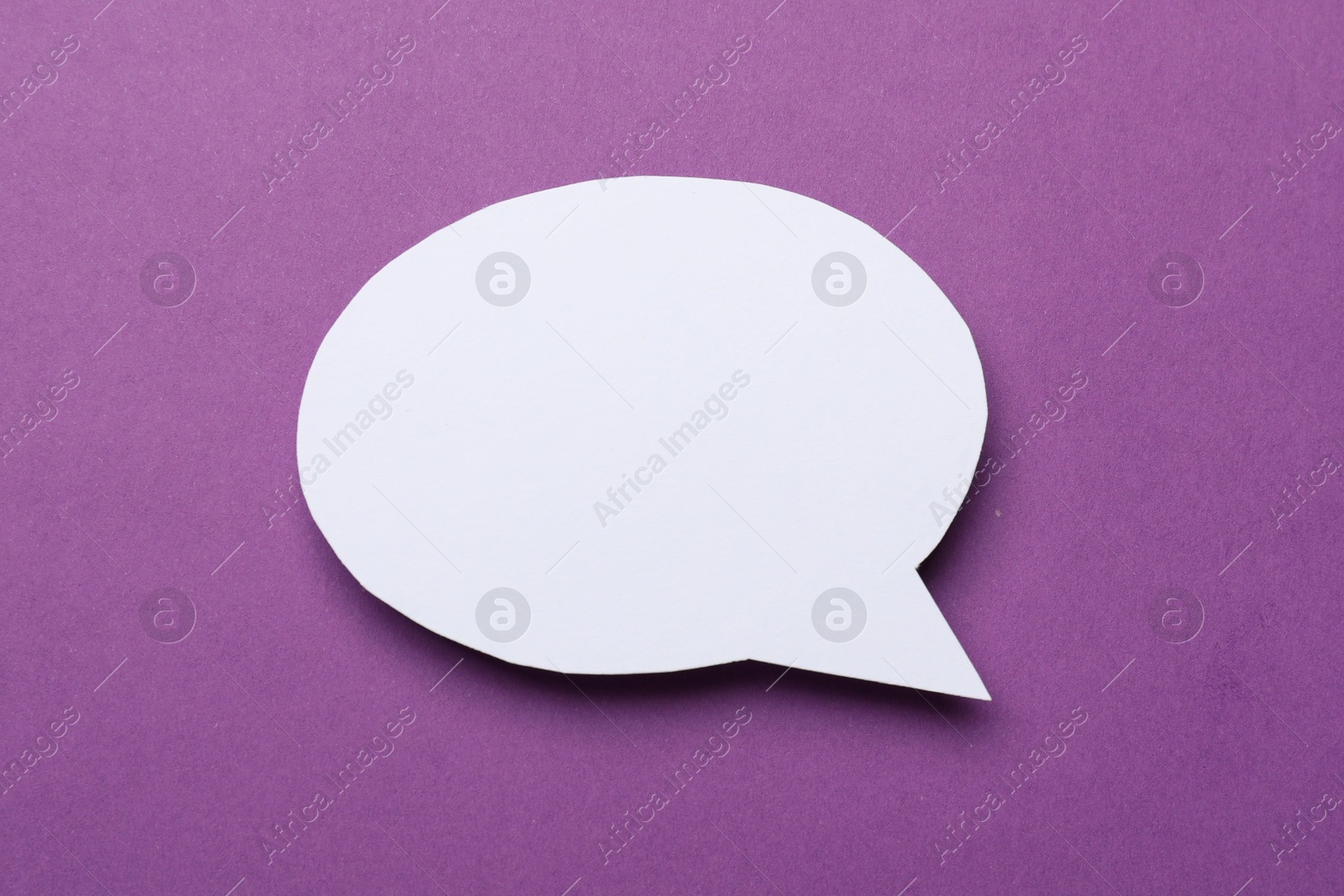 Photo of Blank speech bubble on purple background. Space for text