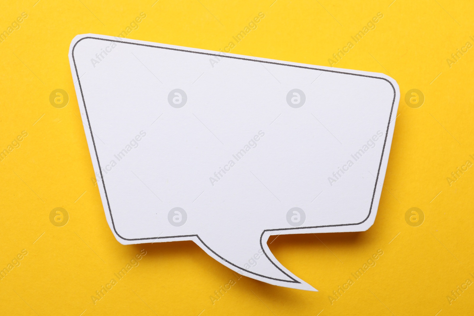 Photo of Blank speech bubble on yellow background. Space for text