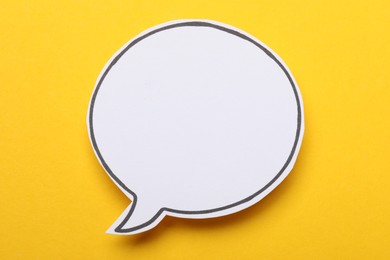 Photo of Blank speech bubble on yellow background. Space for text