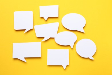 Photo of Blank speech bubbles on yellow background. Space for text