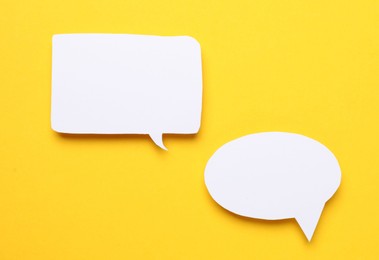 Photo of Blank speech bubbles on yellow background. Space for text