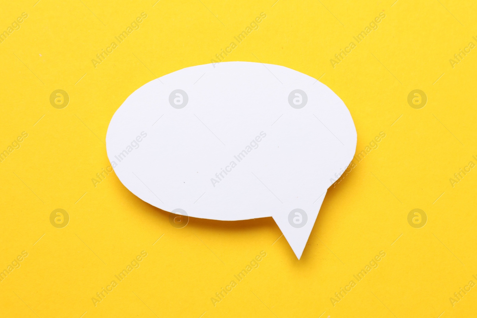 Photo of Blank speech bubble on yellow background. Space for text