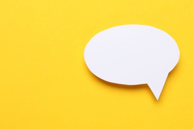 Photo of Blank speech bubble on yellow background. Space for text