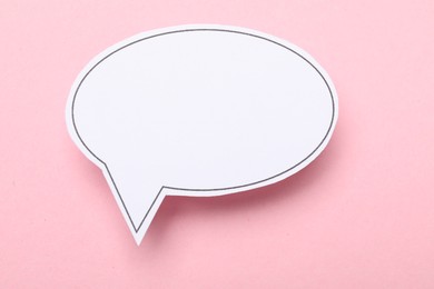 Photo of Blank speech bubble on light pink background. Space for text