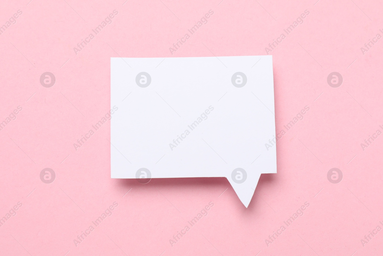 Photo of Blank speech bubble on light pink background. Space for text