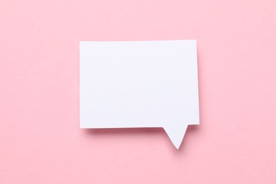 Photo of Blank speech bubble on light pink background. Space for text