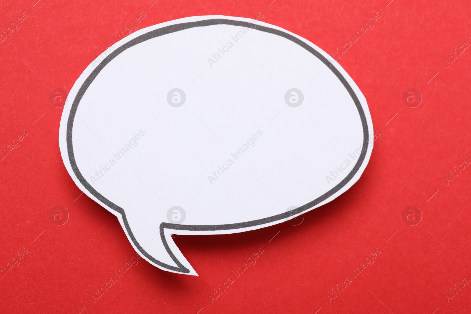 Photo of Blank speech bubble on red background. Space for text