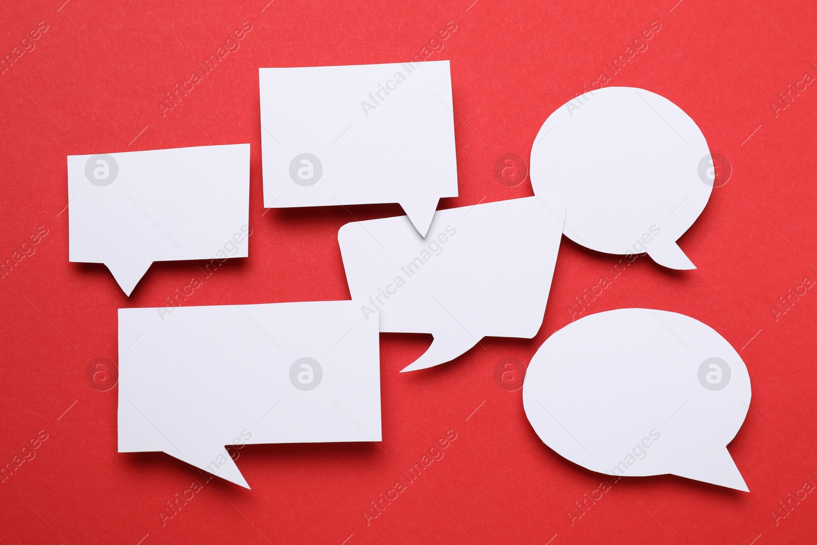 Photo of Blank speech bubbles on red background. Space for text