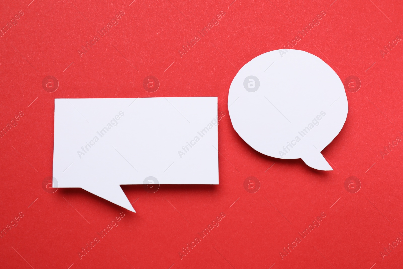 Photo of Blank speech bubbles on red background. Space for text