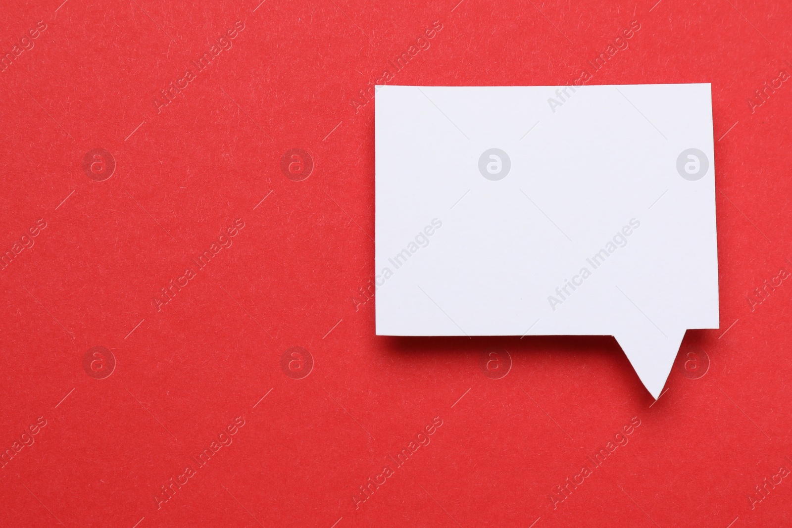 Photo of Blank speech bubble on red background. Space for text