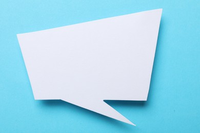 Photo of Blank speech bubble on light blue background. Space for text