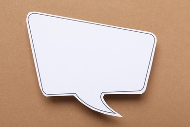 Photo of Blank speech bubble on brown background. Space for text