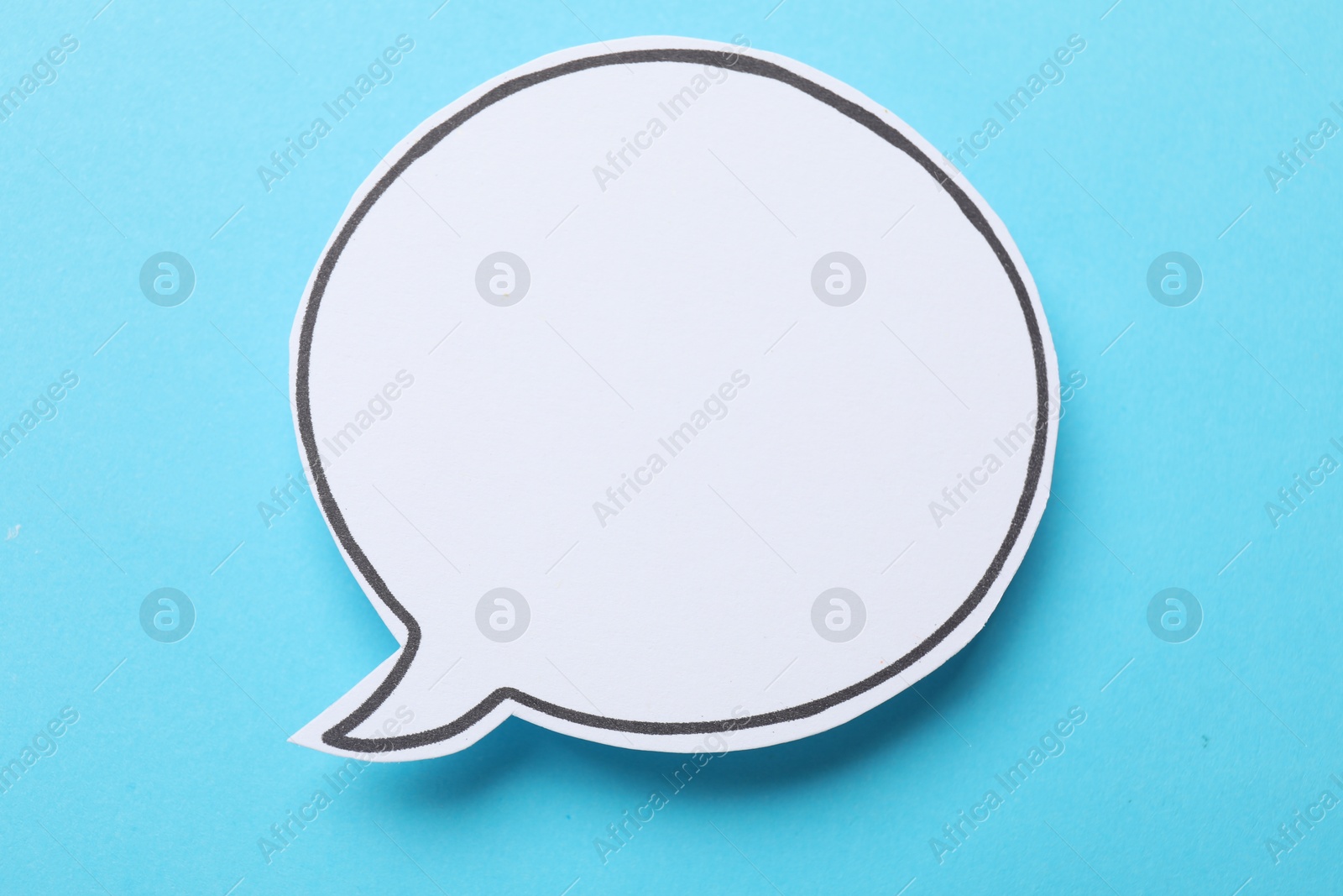 Photo of Blank speech bubble on light blue background. Space for text