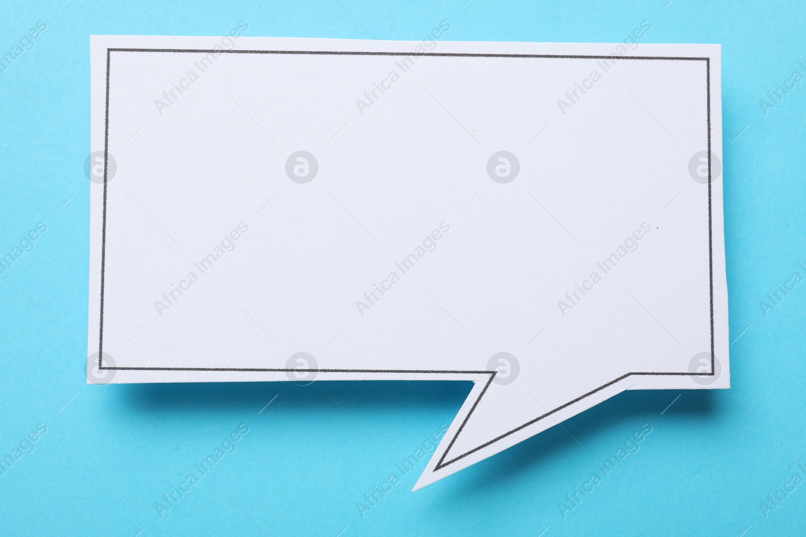 Photo of Blank speech bubble on light blue background. Space for text