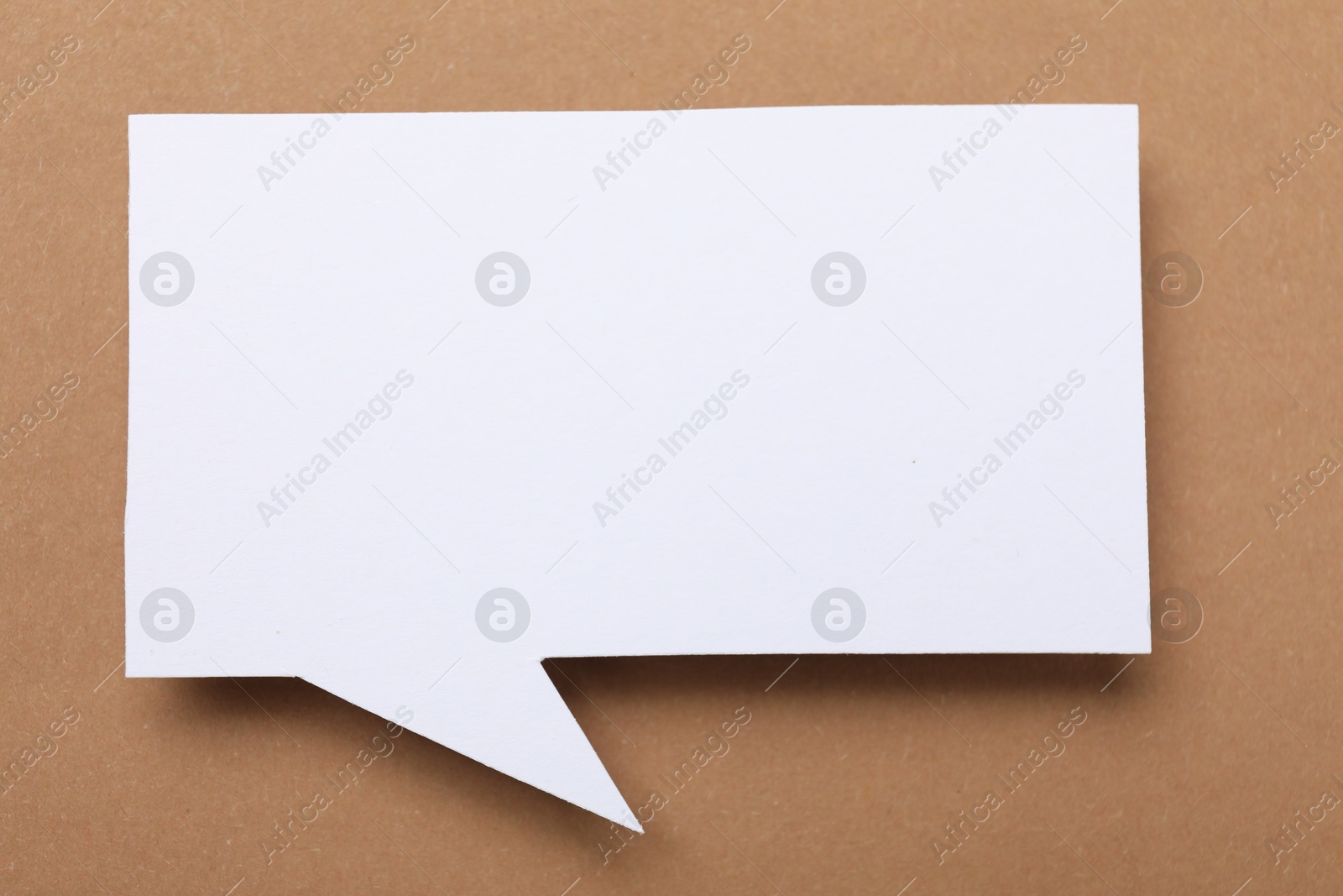 Photo of Blank speech bubble on brown background. Space for text