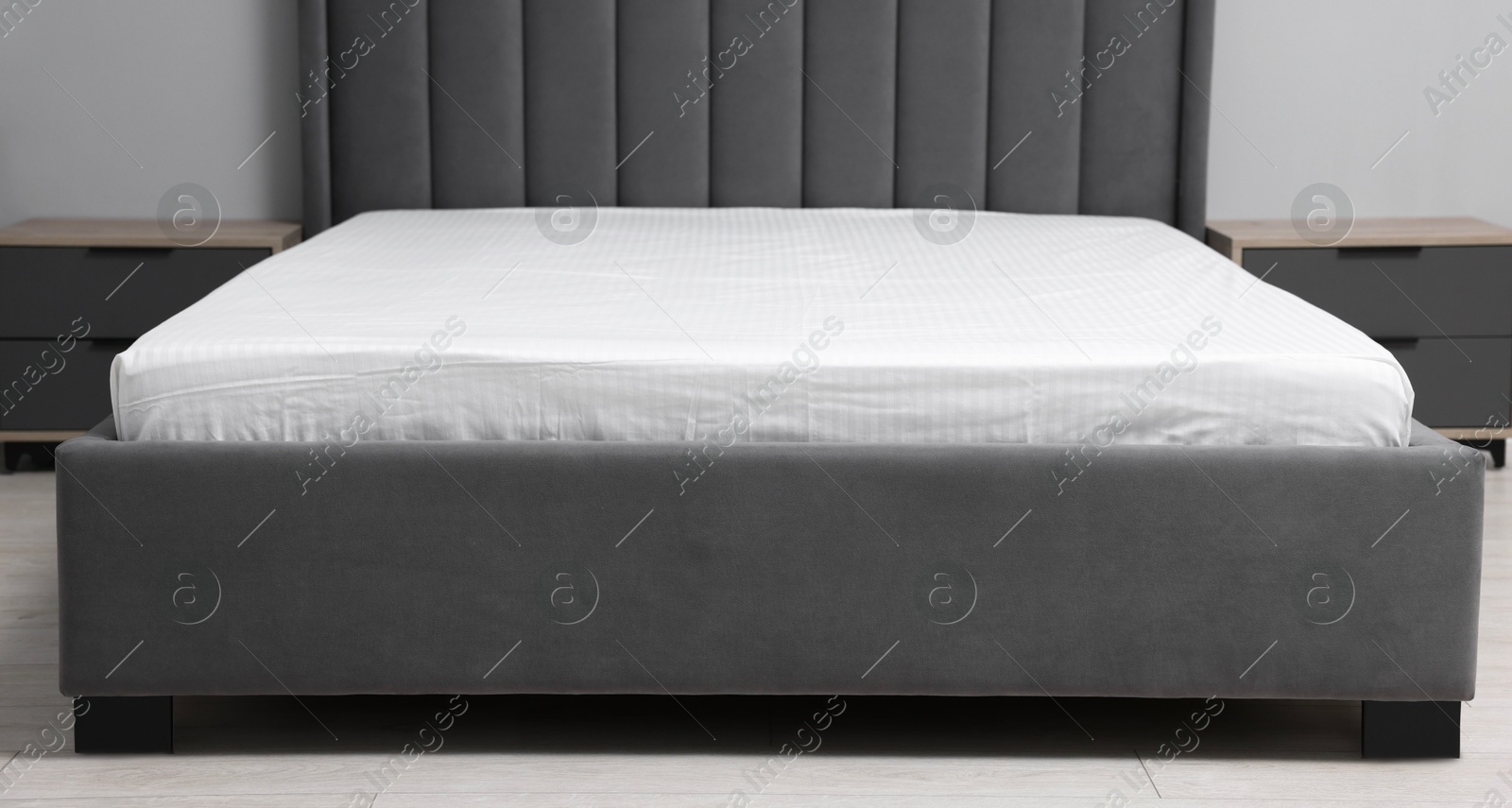 Photo of Comfortable bed with clean linens at home