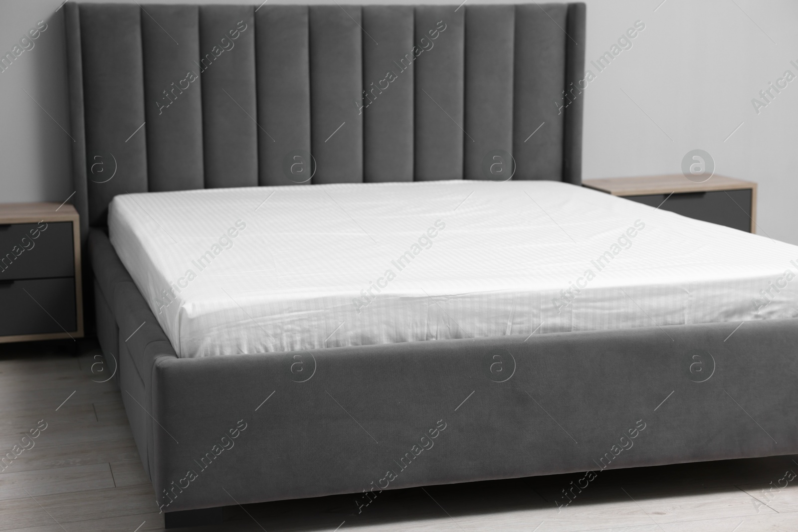 Photo of Comfortable bed with clean linens at home