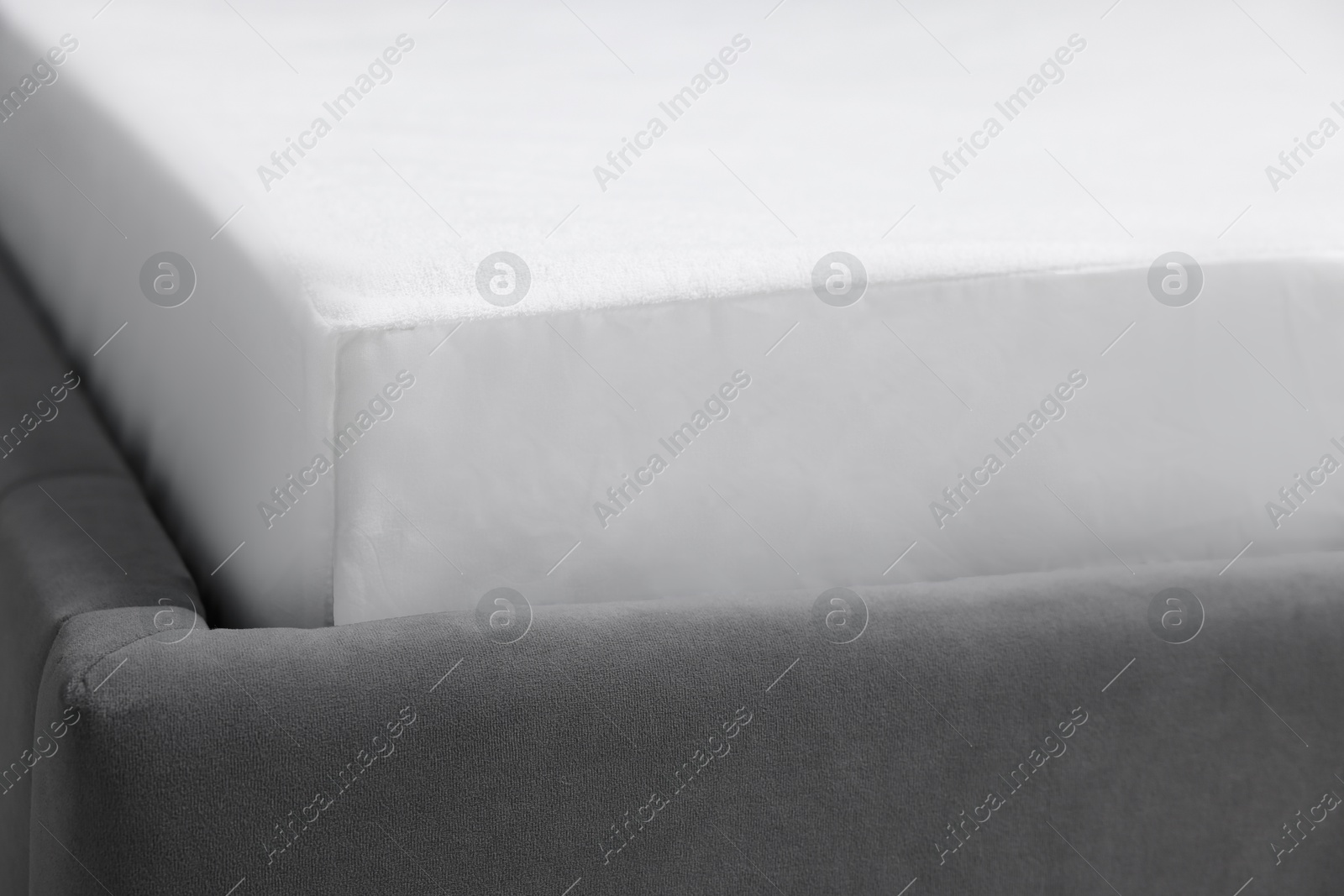 Photo of Comfortable bed with clean linens at home, closeup