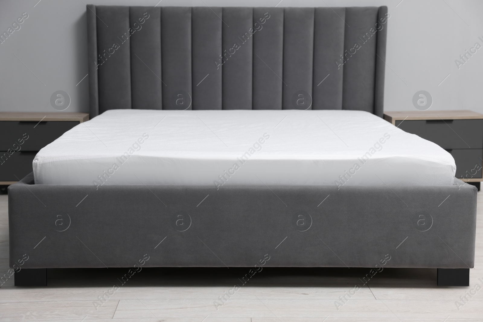 Photo of Comfortable bed with clean linens at home