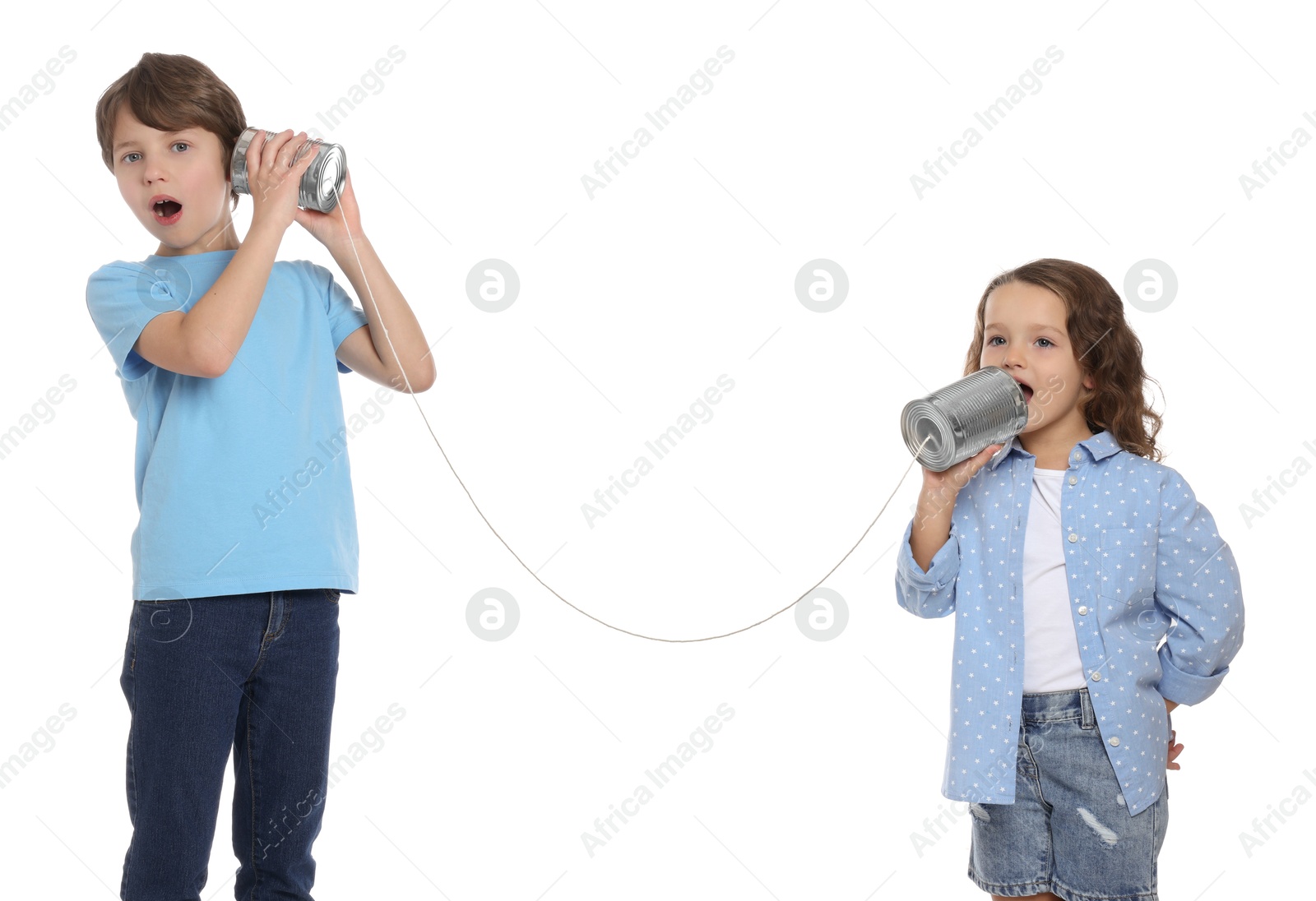 Photo of Boy and girl talking on tin can telephone against white background