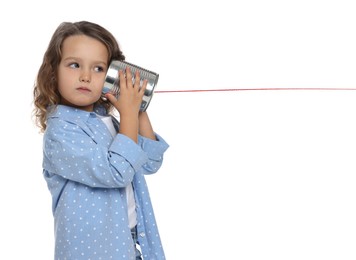 Photo of Girl using tin can telephone on white background