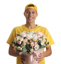 Photo of Smiling delivery man holding gift box with beautiful floral composition on white background