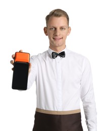 Happy waiter with payment terminal on white background