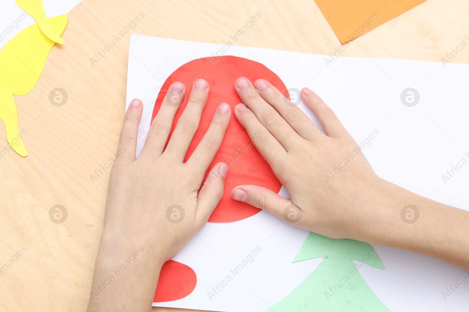 Photo of Girl making art project at table indoors, above view