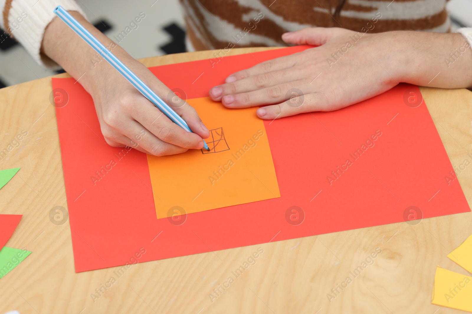 Photo of Girl drawing card at table indoors, closeup. Art and craft