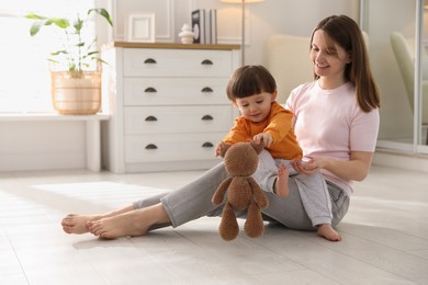 Photo of Happy mother with her little son at home