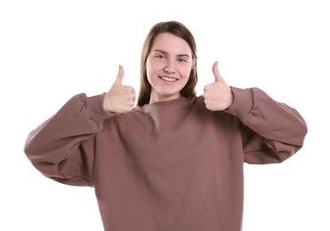 Photo of Happy woman showing thumbs up on white background. Like gesture