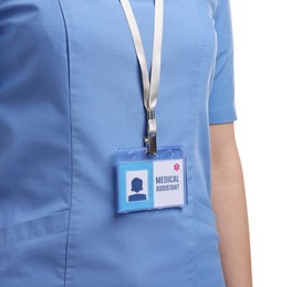 Photo of Medical assistant with badge on white background, closeup