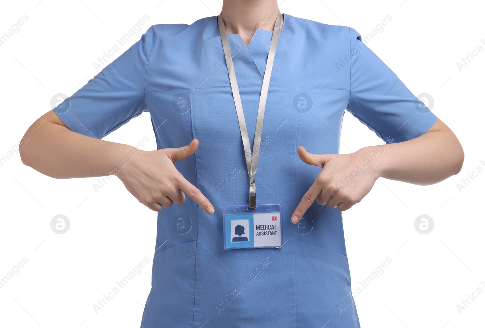 Photo of Medical assistant pointing at her badge on white background, closeup