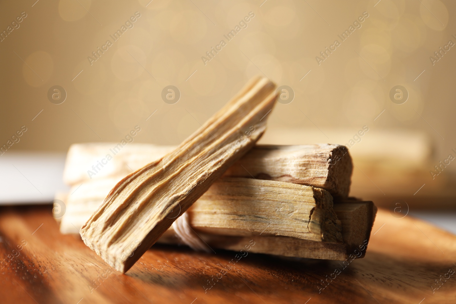 Photo of Pile of palo santo sticks on table, closeup