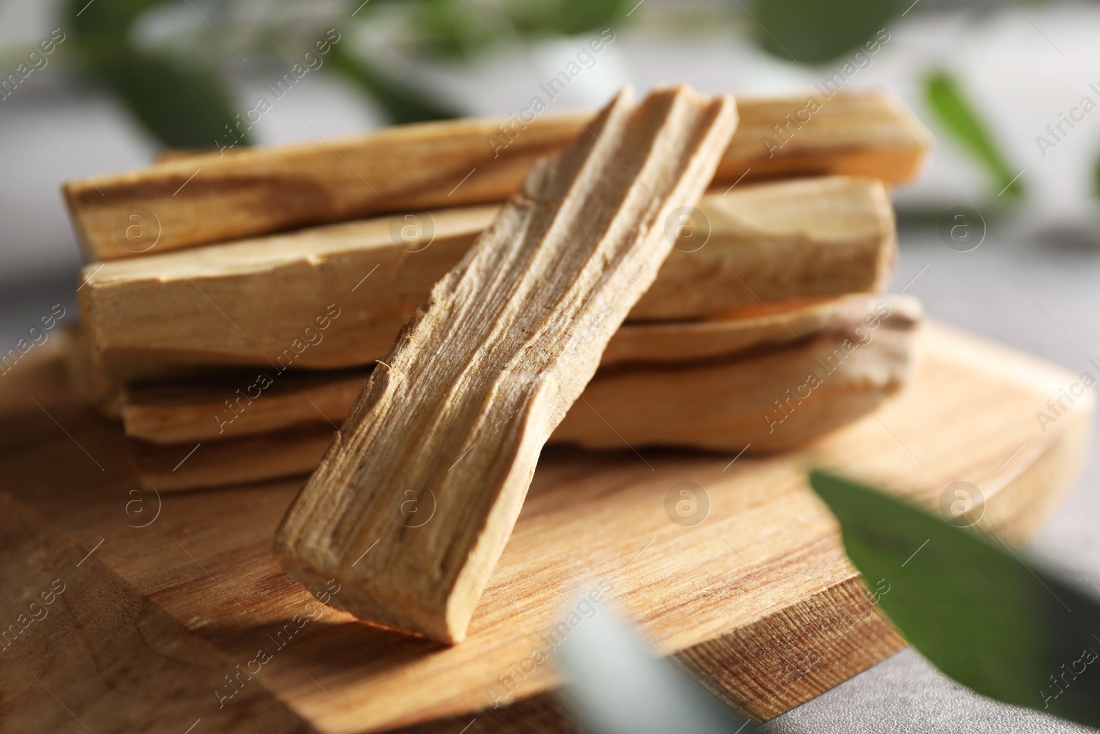 Photo of Pile of palo santo sticks on table, closeup