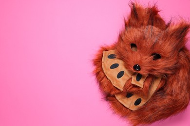 Photo of Quadrobics. Fox mask, gloves and tail on pink background, top view. Space for text