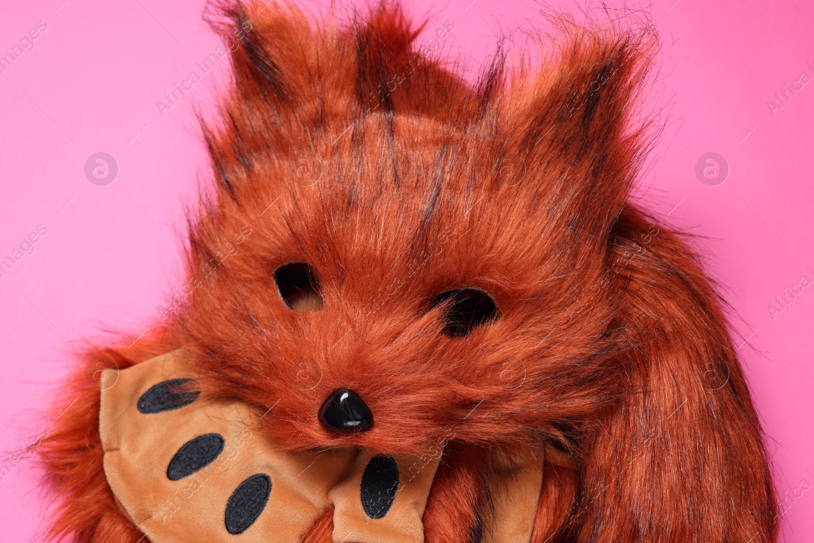 Photo of Quadrobics. Fox mask, gloves and tail on pink background, top view