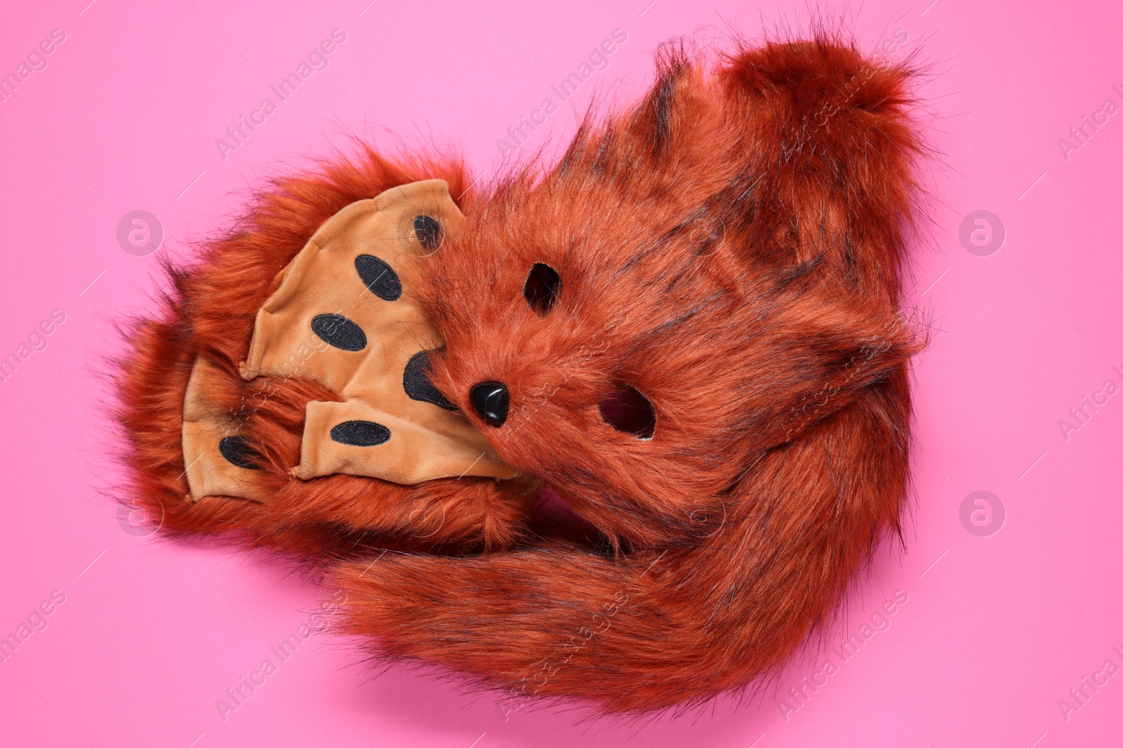 Photo of Quadrobics. Fox mask, gloves and tail on pink background, top view