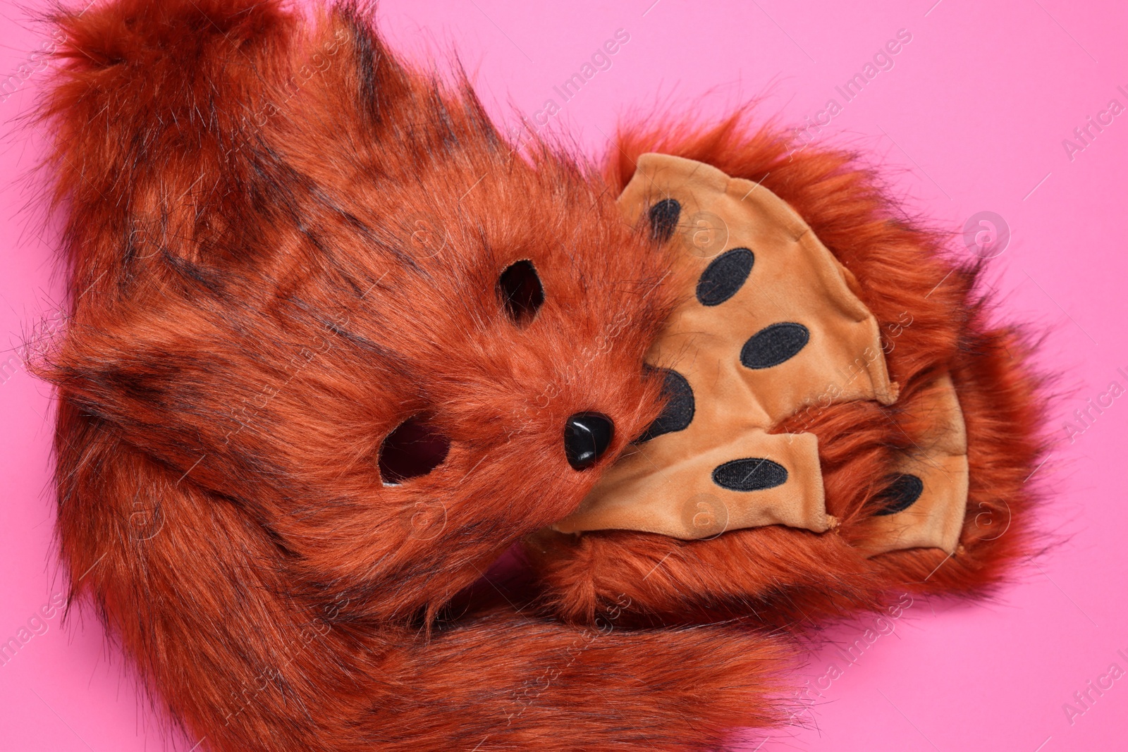 Photo of Quadrobics. Fox mask, gloves and tail on pink background, top view