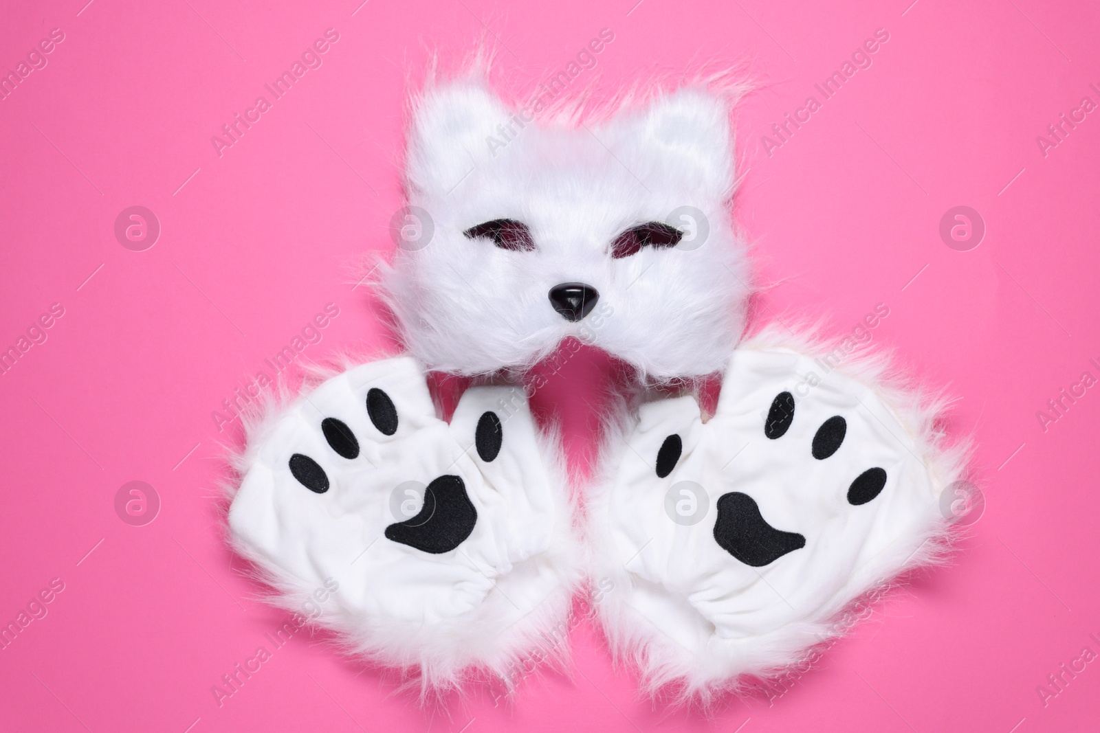 Photo of Quadrobics. Cat mask and gloves on pink background, top view