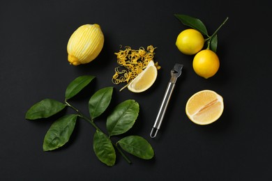 Photo of Lemon zest, zester tool, fresh fruits and leaves on black background, flat lay