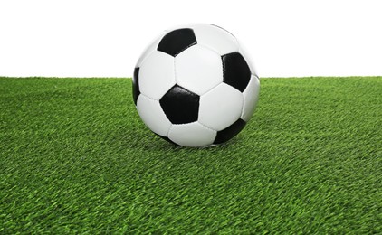 Photo of One soccer ball on green grass against white background. Sport equipment