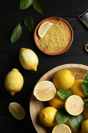 Photo of Lemon zest and fresh fruits on black wooden table, flat lay