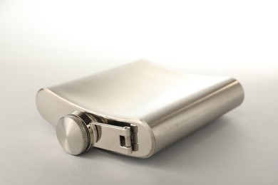 Photo of One hip flask on light table, closeup