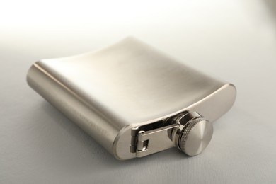 Photo of One hip flask on light table, closeup